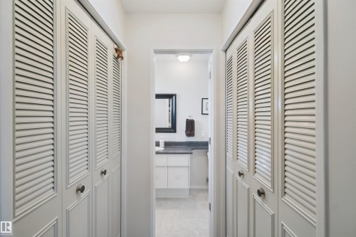 Double closets leading to the 2 pc ensuite bathroom - 11439 144 Avenue Nw, Edmonton, AB 