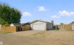 Showing the Utility Lot leased from the City with fenced parking area (approx 38'x18') - 