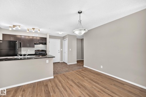 #219 5816 Mullen Pl Nw, Edmonton, AB - Indoor Photo Showing Kitchen With Double Sink