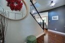 Hardwood-style flooring extends through the space - 2203 Warry Loop Sw, Edmonton, AB 