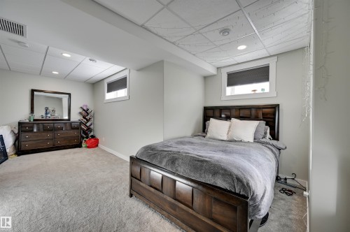 Recessed lighting, light-toned carpeting, and a drop ceiling - 2203 Warry Loop Sw, Edmonton, AB 