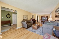Light wood-finish flooring throughout, offering a cohesive aesthetic - 