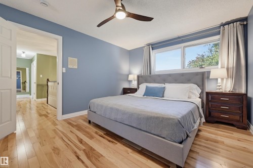 Hardwood flooring, ceiling fan, expansive window, recessed lighting, and a neutral color palette - 30 Gariepy Crescent Nw, Edmonton, AB 