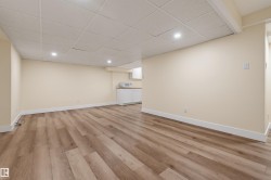 Recessed lighting, drop ceiling, wood-finish flooring, built-in cabinetry, and integrated sink - 
