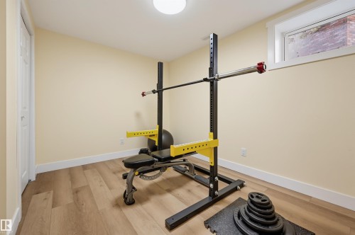 Wood-finish flooring, white trim, and a high-set window - 30 Gariepy Crescent Nw, Edmonton, AB 