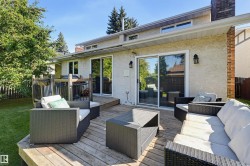 Expansive wood deck with direct access to the interior via two sliding glass doors - 
