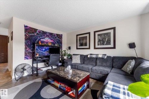 Recessed lighting, wood-finish flooring, and white painted walls - 16012 98 Avenue Nw, Edmonton, AB 