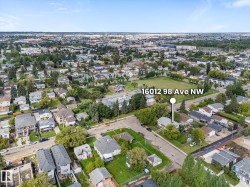 Residential neighborhood setting with established trees and surrounding green spaces - 