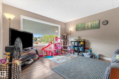 Wood-finish flooring with neutral wall tones - 16012 98 Avenue Nw, Edmonton, AB 