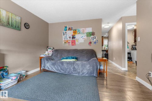 Wood-finish flooring throughout, complemented by neutral wall tones - 16012 98 Avenue Nw, Edmonton, AB 