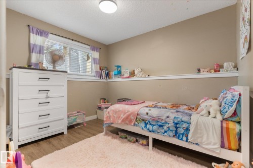 Wood-finish flooring with a neutral wall color - 16012 98 Avenue Nw, Edmonton, AB 