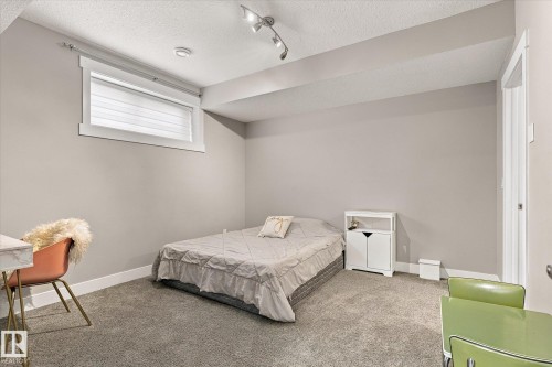 Carpeted flooring, recessed lighting, and a white window frame with blinds - 2011 Genesis Lane, Stony Plain, AB 