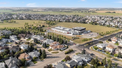 Aerial perspective showcasing a residential community with varied rooflines and established landscaping - 10621 175A Avenue Nw, Edmonton, AB 