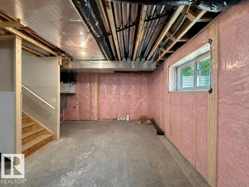 Expansive unfinished basement featuring concrete flooring, exposed ceiling joists, and insulated perimeter walls - 9216 91 Street Nw, Edmonton, AB - Indoor Photo Showing Basement