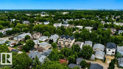 Residential setting featuring diverse housing styles and abundant mature trees - 9216 91 Street Nw, Edmonton, AB - Outdoor With View