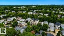 Residential setting featuring diverse housing styles and abundant mature trees - 9216 91 Street Nw, Edmonton, AB  - Outdoor 