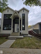 Striking contemporary exterior featuring vertical siding and dark accent panels - 