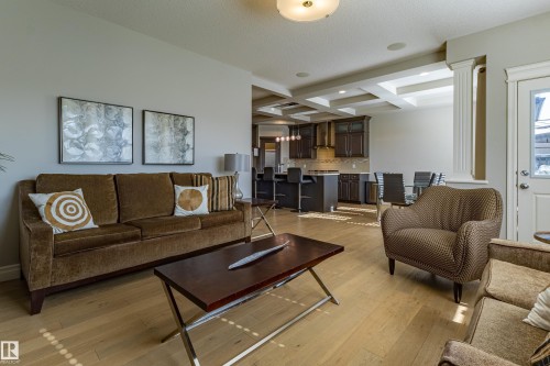 Hardwood-finish flooring, recessed lighting, and a coffered ceiling - 233 Hawks Ridge Boulevard Nw, Edmonton, AB 