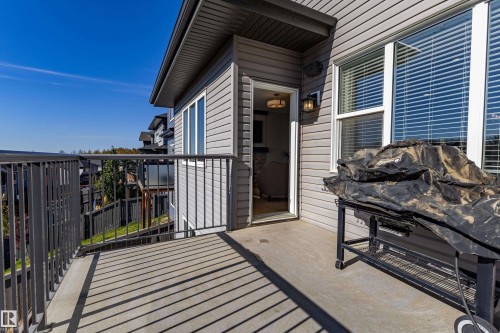 Exterior balcony with a concrete surface and metal railings - 233 Hawks Ridge Boulevard Nw, Edmonton, AB 