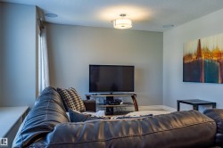Built-in ceiling speakers, recessed lighting, and a flush mount light fixture - 