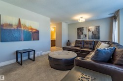 Recessed lighting, ceiling-mounted light fixture, and carpeted flooring - 