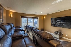 Recessed ceiling lighting, wall-mounted sconces, and built-in ceiling speakers - 