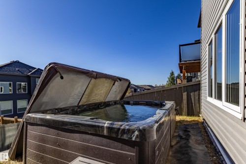 Outdoor hot tub with a protective cover - 233 Hawks Ridge Boulevard Nw, Edmonton, AB 