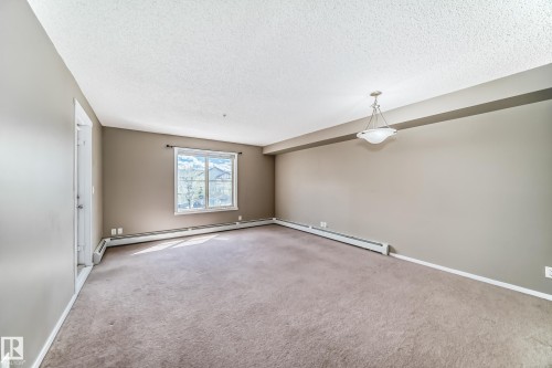 #210 3315 James Mowatt Tr Sw Sw, Edmonton, AB - Indoor Photo Showing Other Room