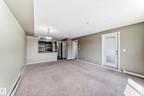 #210 3315 James Mowatt Tr Sw Sw, Edmonton, AB - Indoor Photo Showing Other Room