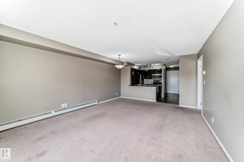 #210 3315 James Mowatt Tr Sw Sw, Edmonton, AB - Indoor Photo Showing Other Room