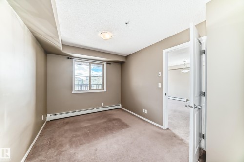 #210 3315 James Mowatt Tr Sw Sw, Edmonton, AB - Indoor Photo Showing Other Room