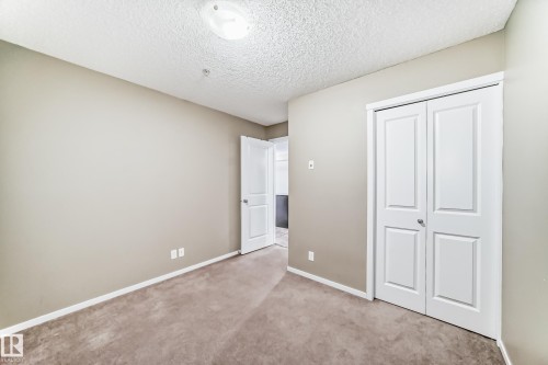 #210 3315 James Mowatt Tr Sw Sw, Edmonton, AB - Indoor Photo Showing Other Room