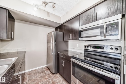 #210 3315 James Mowatt Tr Sw Sw, Edmonton, AB - Indoor Photo Showing Kitchen