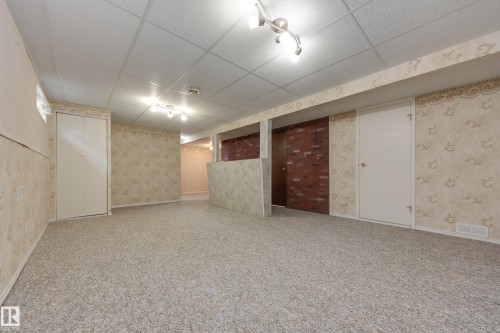 Finished space with drop ceiling, recessed lighting, and track lighting - 3421 135A Avenue Nw, Edmonton, AB 