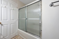 Tub and shower combination with sliding glass doors - 