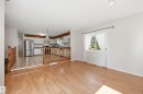 Wood-finish flooring, white walls, and a window with white trim - 11102 11A Avenue Nw, Edmonton, AB 