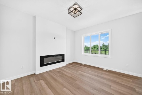106 Waverly Way, Fort Saskatchewan, AB - Indoor Photo Showing Living Room With Fireplace