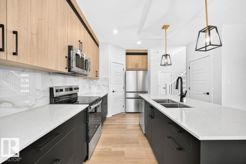 106 Waverly Way, Fort Saskatchewan, AB - Indoor Photo Showing Kitchen With Double Sink With Upgraded Kitchen