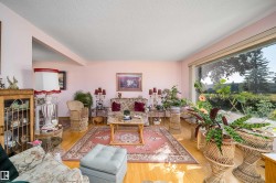 Hardwood flooring, expansive window, built-in display cabinetry, cased opening, textured ceiling - 