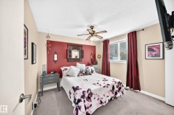 Recessed ceiling fan, neutral carpet flooring, single window with white frame, two-tone wall treatment, and built-in closet - 
