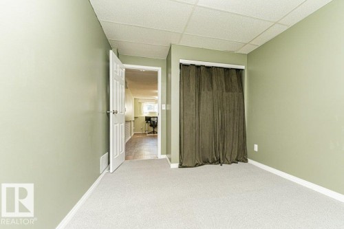 Light green painted walls, white trim, and light gray carpeting - 6 Kiniski Crescent Nw, Edmonton, AB 
