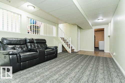 Carpeted flooring, wood-finish flooring, white painted walls, drop ceiling, white painted railing - 6 Kiniski Crescent Nw, Edmonton, AB 