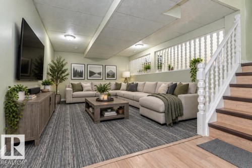 Recessed lighting, wood-finish flooring, white banister with turned spindles, textured broadloom carpeting, and a built-in media console - 6 Kiniski Crescent Nw, Edmonton, AB 