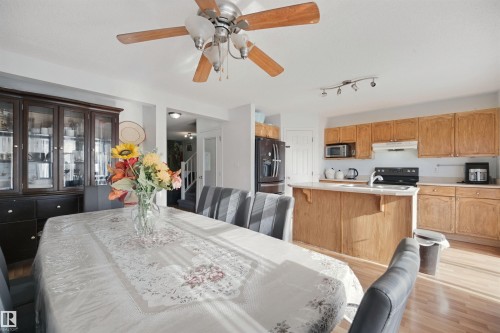 Wood-finish flooring throughout - 15911 38 Street Nw, Edmonton, AB 