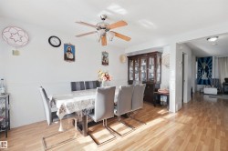 Recessed lighting, wood-finish flooring, and a ceiling fan with integrated lighting - 