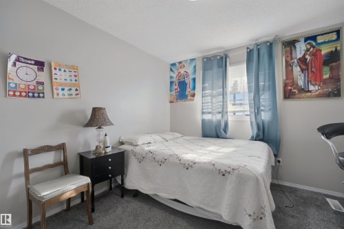 Carpeted flooring, painted walls, window with blinds, and ceiling - 15911 38 Street Nw, Edmonton, AB 