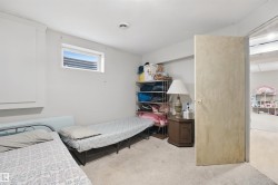 Recessed window, built-in storage cabinet, and neutral-toned carpeting - 