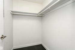 Built-in white wire shelving with dual hanging rods - 