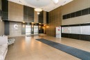 Lobby featuring large format floor tiles, dual elevators with stainless steel doors, and wall-mounted mailboxes - #1902 10388 105 St Nw, Edmonton, AB 