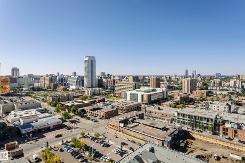 Expansive urban landscape featuring a mix of commercial and residential structures under a clear sky - #1902 10388 105 St Nw, Edmonton, AB 